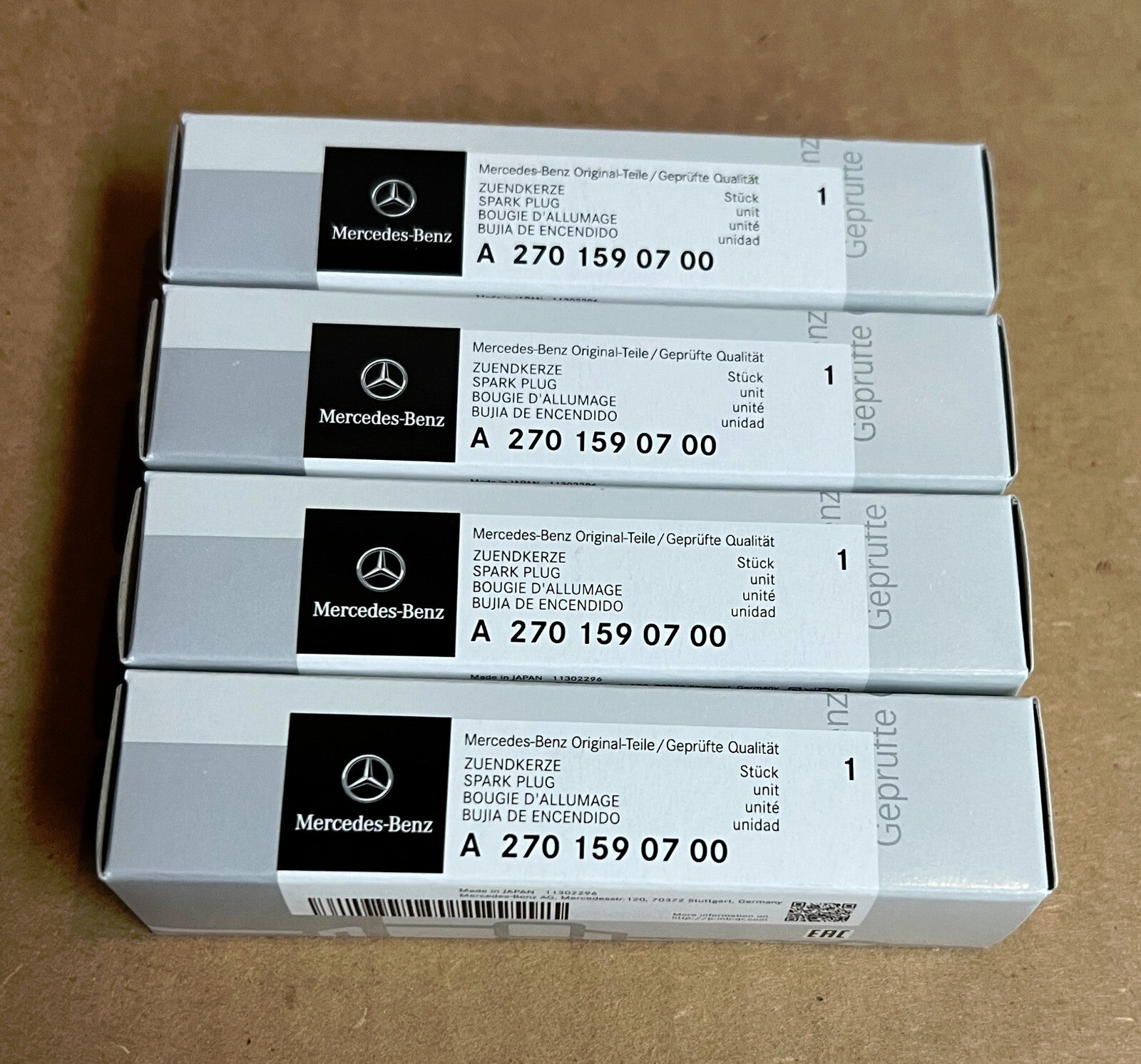 New Genuine OEM Mercedes  A2701590700  - Set of 4 Spark Plugs